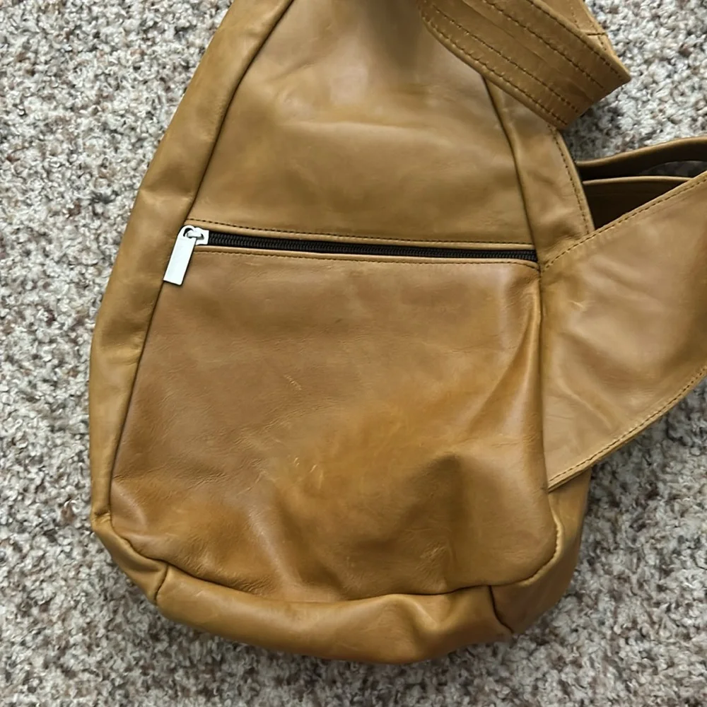 Genuine leather sling backpack